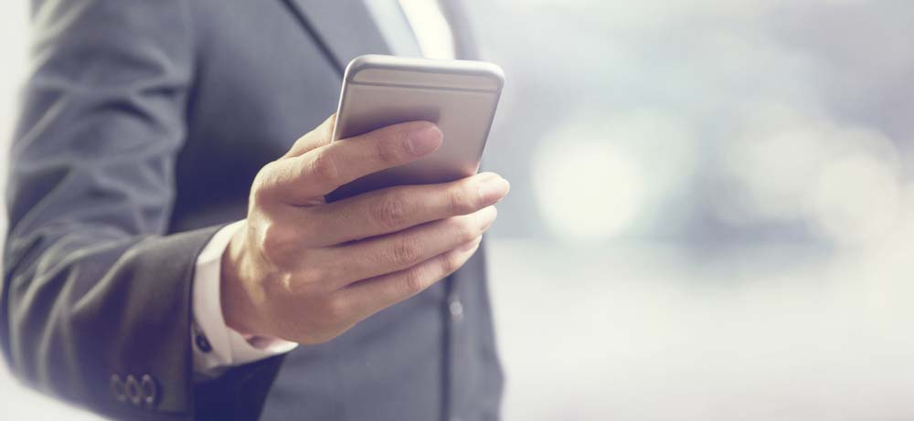 Man using mobile phones reflecting the importance of AMP and AMP updates