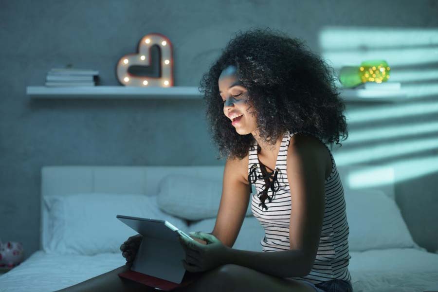 Woman watching mobile video, demonstrating importance of video strategy